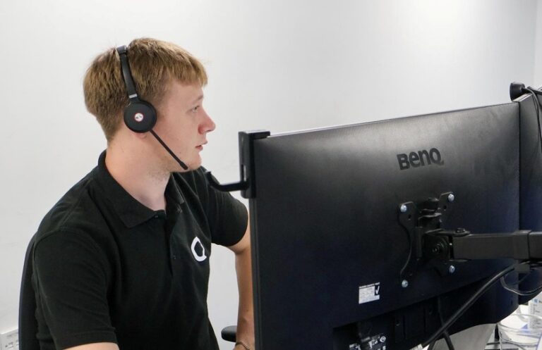 Qlic IT Engineer on a teams call, collaborating with colleagues