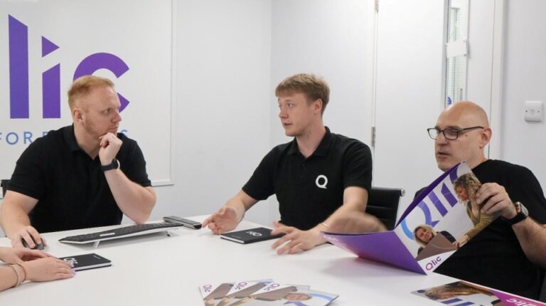 The Qlic Team having a meeting around Data Management