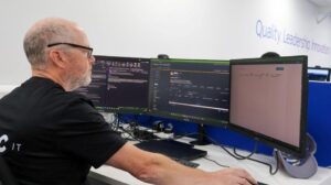 engineer using triple screens